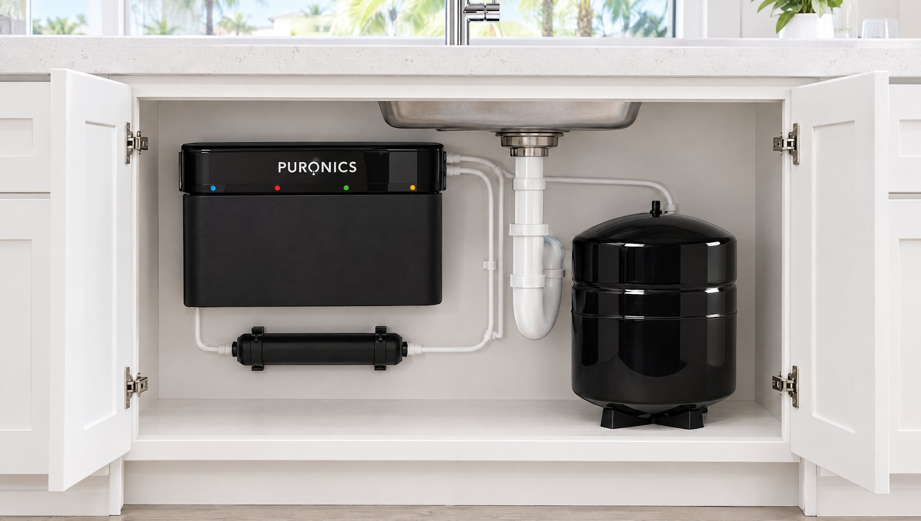 A Puronics Micromax 8500 reverse osmosis system installed under a kitchen sink with its storage tank